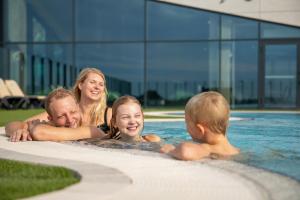 a group of people in a swimming pool at Lalandia Søndervig in Søndervig