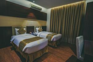 Postel nebo postele na pokoji v ubytování Meral Oasis Resort Taif