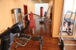 a gym with several exercise bikes and a treadmill at The Burj Ghazanfar in Mazar-e Sharif 