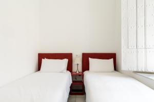 Postel nebo postele na pokoji v ubytování OleHousing-San Lorenzo