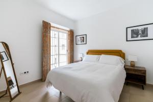 Postel nebo postele na pokoji v ubytování OleHousing-San Lorenzo