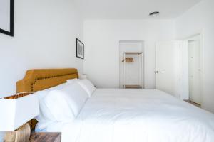 Postel nebo postele na pokoji v ubytování OleHousing-San Lorenzo