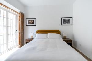 Postel nebo postele na pokoji v ubytování OleHousing-San Lorenzo