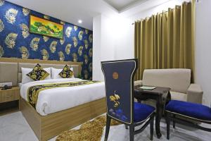 Ένα ή περισσότερα κρεβάτια σε δωμάτιο στο Hotel Decent Suites - Delhi Airport