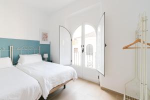 Postel nebo postele na pokoji v ubytování OleHousing-San Lorenzo