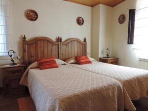 A bed or beds in a room at Cal Sandic