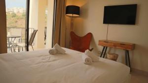 Posteľ alebo postele v izbe v ubytovaní Marbella Resort, Samara By Houselogy