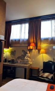 Postel nebo postele na pokoji v ubytování LU Suites