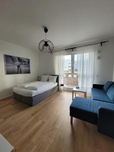 Posteľ alebo postele v izbe v ubytovaní 16 Apartamenty Ptak Szpital Matki Polki Szpital Kopernika Mandoria Orientarium Atlas Arena Plac Zabaw - Zamojska 20a m16 Parking