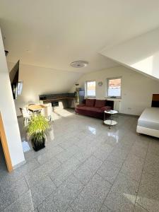 a large living room with a couch and a table at Casa Nero in Leimen