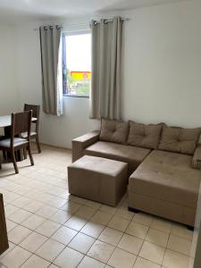 a living room with a couch and a table at Martin Quintanilha 1B in Goiânia