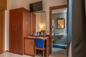 Postel nebo postele na pokoji v ubytování Hotel Bonifacio