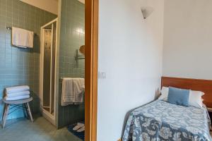 Postel nebo postele na pokoji v ubytování Hotel Bonifacio
