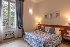 Postel nebo postele na pokoji v ubytování Hotel Bonifacio