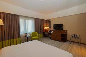 TV a/nebo společenská místnost v ubytování The Grand Lux Hotel