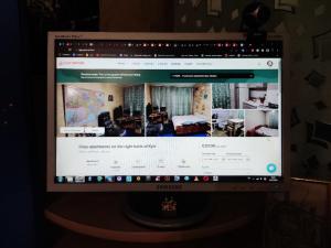 a computer monitor sitting on top of a table at Cozy apartments on the right bank of Kyiv in Kyiv