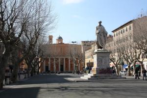 a statue in the middle of a city street at H33 Boutique Apartment in Livorno centro in Livorno