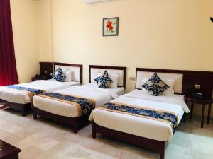 Letto o letti in una camera di Farah Hotel Apartment