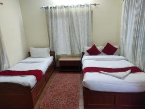 Postel nebo postele na pokoji v ubytování Hotel Snow Leopard