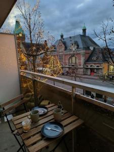 a balcony with a table with two toilets on it at Charmant studio - Gare colmar in Colmar