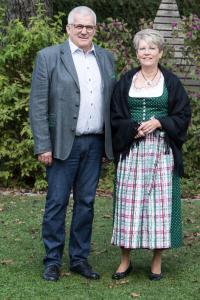 a man and a woman standing in the grass at Privatzimmer und Ferienwohnungen Leeb in Persenbeug