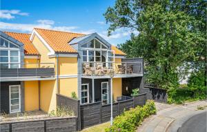 a yellow house with an orange roof at Awesome Home In Skagen With 3 Bedrooms And Wifi in Skagen