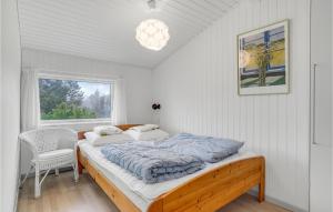 Katil atau katil-katil dalam bilik di 3 Bedroom Beautiful Home In Blokhus