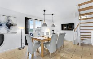 a dining room with a table and chairs at Holiday Home Vestergade Rømø in Rømø Kirkeby