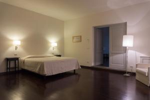Posteľ alebo postele v izbe v ubytovaní Relais Villa Il Palagio