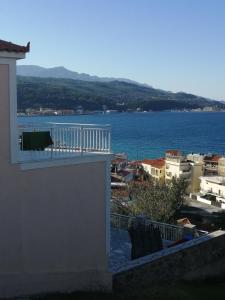 a view of the ocean from a balcony of a building at Robert House in Samos
