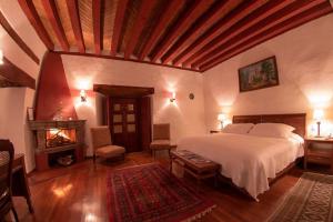 Llit o llits en una habitació de Hotel Boutique Posada La Basilica