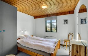 a bedroom with a bed and a wooden ceiling at 3 Bedroom Beautiful Home In Vestervig in Vestervig