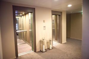 Um banheiro em THE ONE Grand Hotel da Póvoa - by MHMB Hospitality