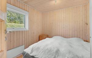 a bedroom with a bed and a window in it at Nice Home In Hejls With 4 Bedrooms And Wifi in Hejls