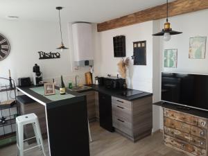 Kuchyňa alebo kuchynka v ubytovaní Comme à la Maison