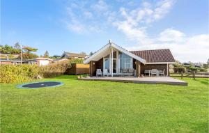 a home with a large yard with a house at Cozy Home In Slagelse With Kitchen in Slagelse