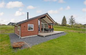 a small cabin with a deck and a lawn at Nice Home In Slagelse With Wifi in Slagelse