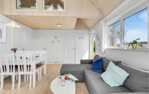 a living room with a couch and a table at Lovely Home In Tranekær With Wifi in Tranekær