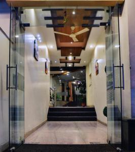 a hallway of a building with stairs and a ceiling at Regal Hotel in Ajmer