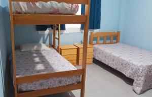 Postel nebo postele na pokoji v ubytování IntiPunku