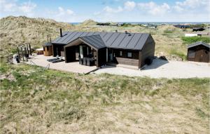 an overhead view of a house in a field at Studio Holiday Home In Lokken in Løkken