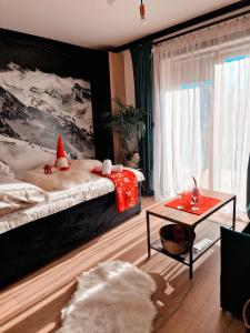 a bedroom with a bed with a santa hat on it at Góralska Chata in Czarna Góra