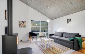 a living room with a couch and a table at Pet Friendly Home In Gistrup With Wifi in Gistrup