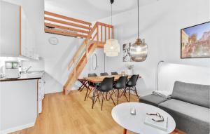 a living room with a couch and a table at Two-Bedroom Apartment In Ringkobing in Ringkøbing