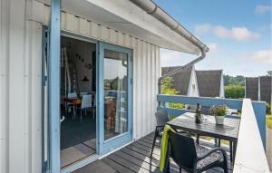 a patio with a table and chairs on a deck at Studio Apartment In Knebel in Knebel