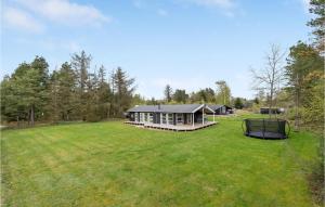 a large yard with a large house with a gazebo at Holiday Home Sletten Hadsund Xii in Helberskov +18 photos