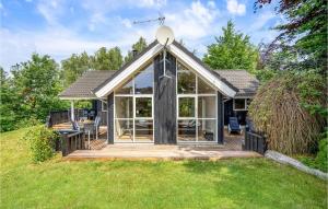 a home with a large deck with a gazebo at Amazing Home In Ebeltoft With 3 Bedrooms, Sauna And Wifi in Ebeltoft