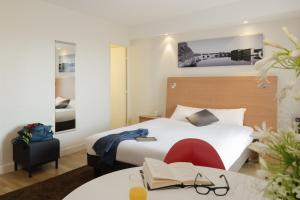 Aparthotel Adagio Toulouse Centre Ramblas客房内的一张或多张床位