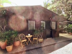 a small house with two chairs and a table at Sanctuary in The Pocket in The Pocket