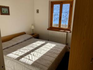 Posteľ alebo postele v izbe v ubytovaní Tonale 80
